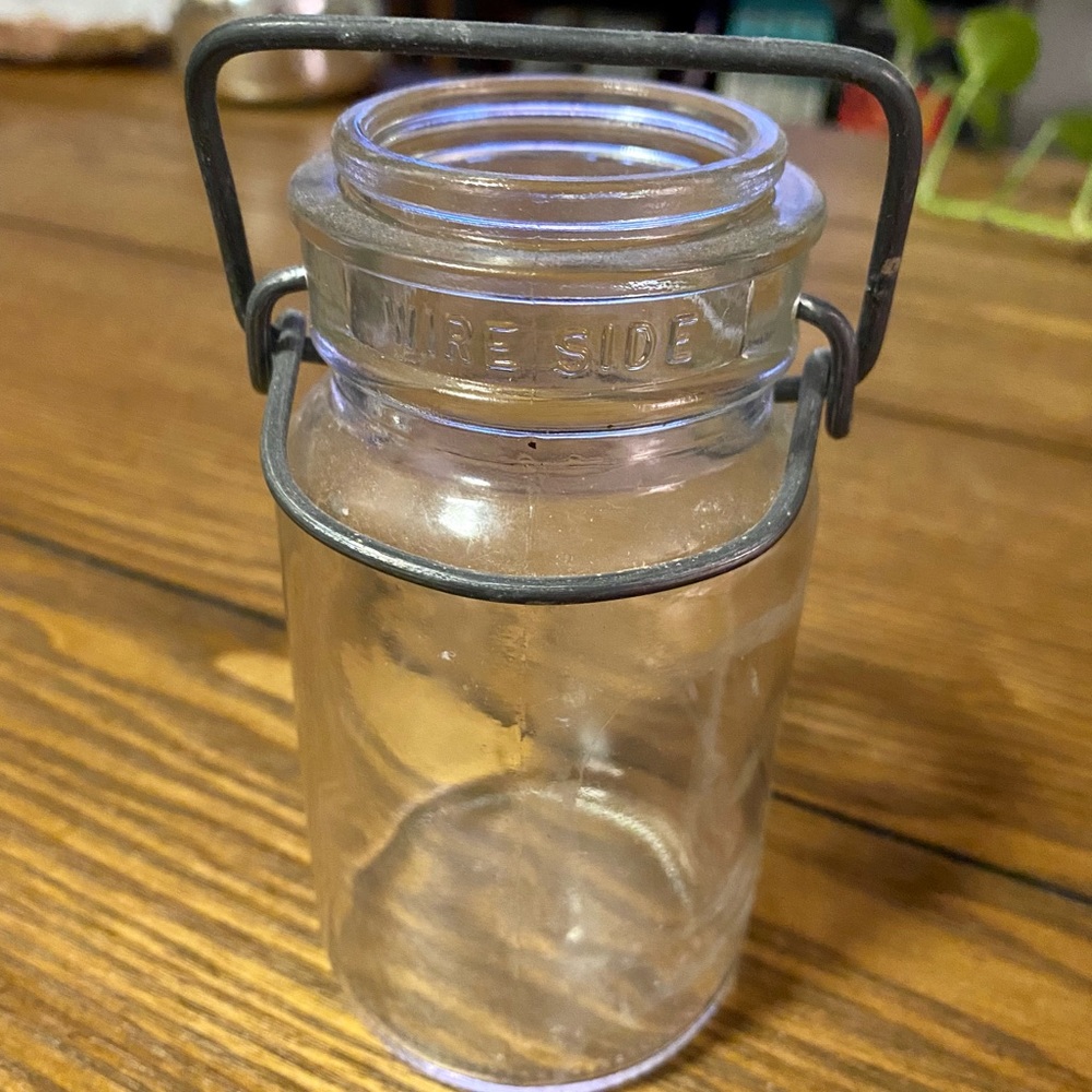Antique decorative glass jar with metal clasp